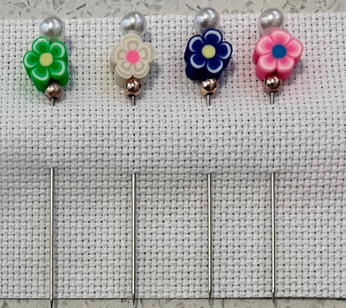 various coloured flowers counting pins